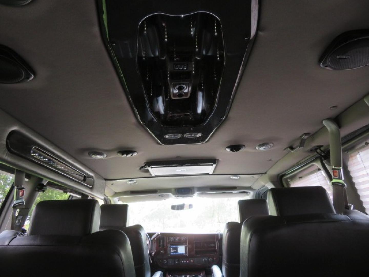 2014 Chevrolet Express (1GBWGLCG3E1) , located at 4301 Oak Circle #19, Boca Raton, FL, 33431, (954) 561-2499, 26.388861, -80.084038 - You are looking at a Rare 2014 Chevy Express 2500 Quigley 4x4 Four Wheel Drive Explorer Limited SE 9 Passenger Conversion Van with: 107K Original Miles, 6 Captain Chairs, Rear Power Folding Bench Seat Bed, Center Consoler Cooler, Front PPF (Paint Protection Film) Explorer Limited Conversion Througho - Photo#59